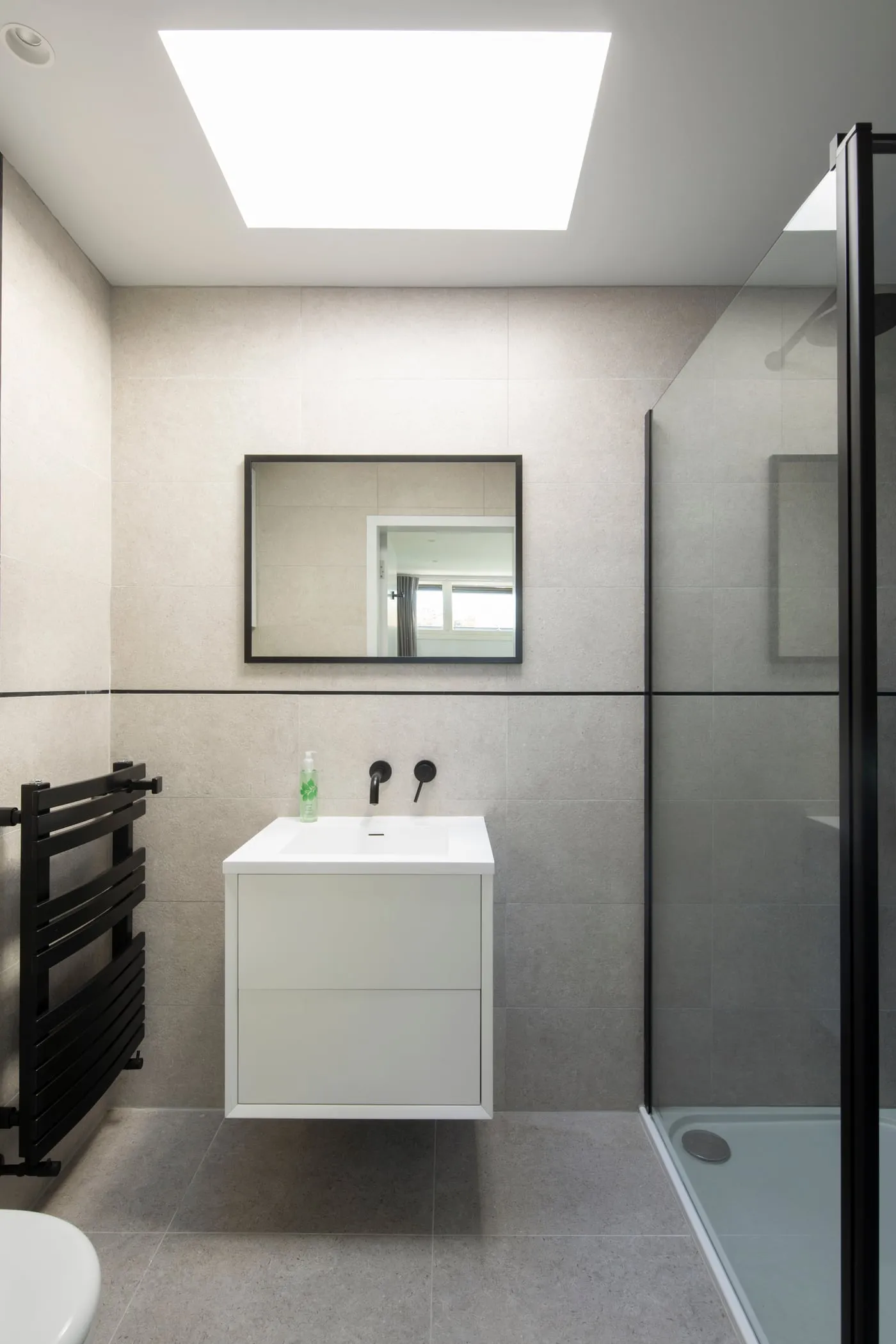 Bathroom with feature mirror and basin