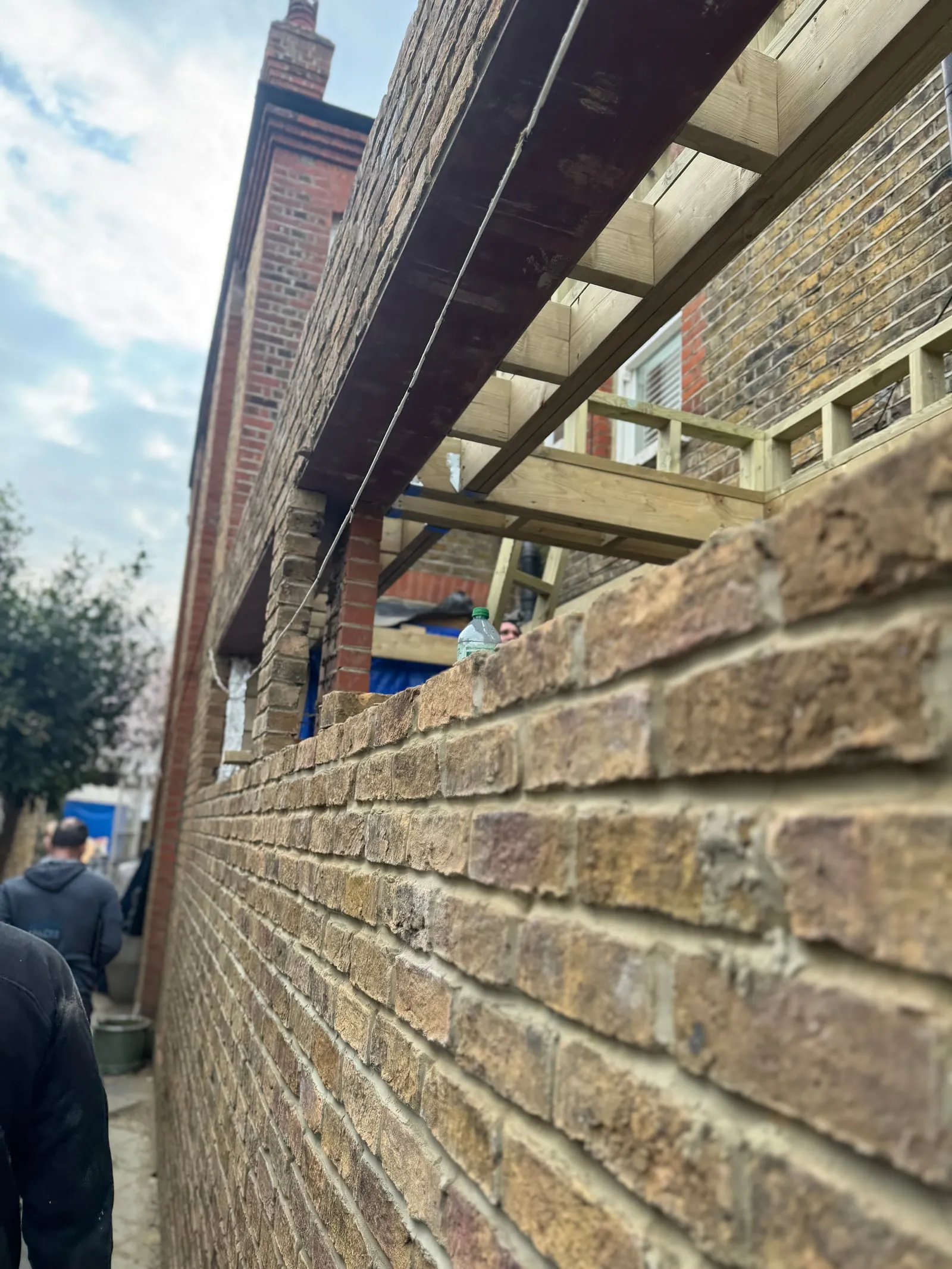 Close detail of new brickwork below the roof structure