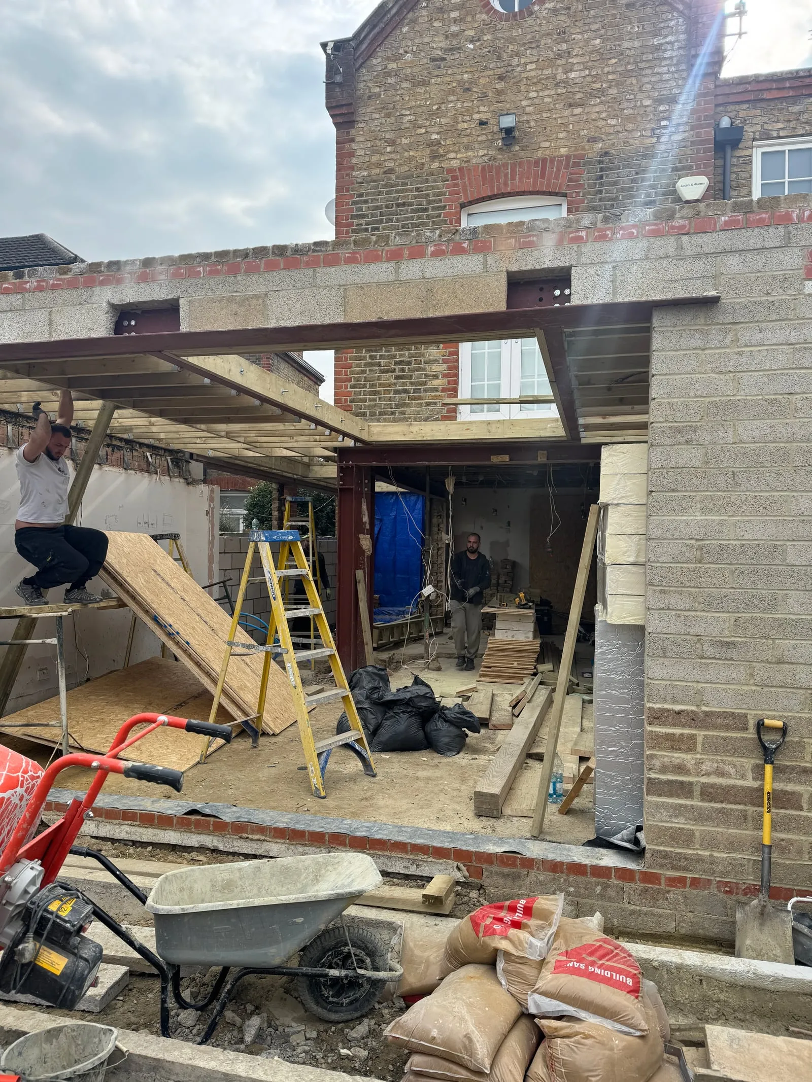 Roof structure being built up with timber joists
