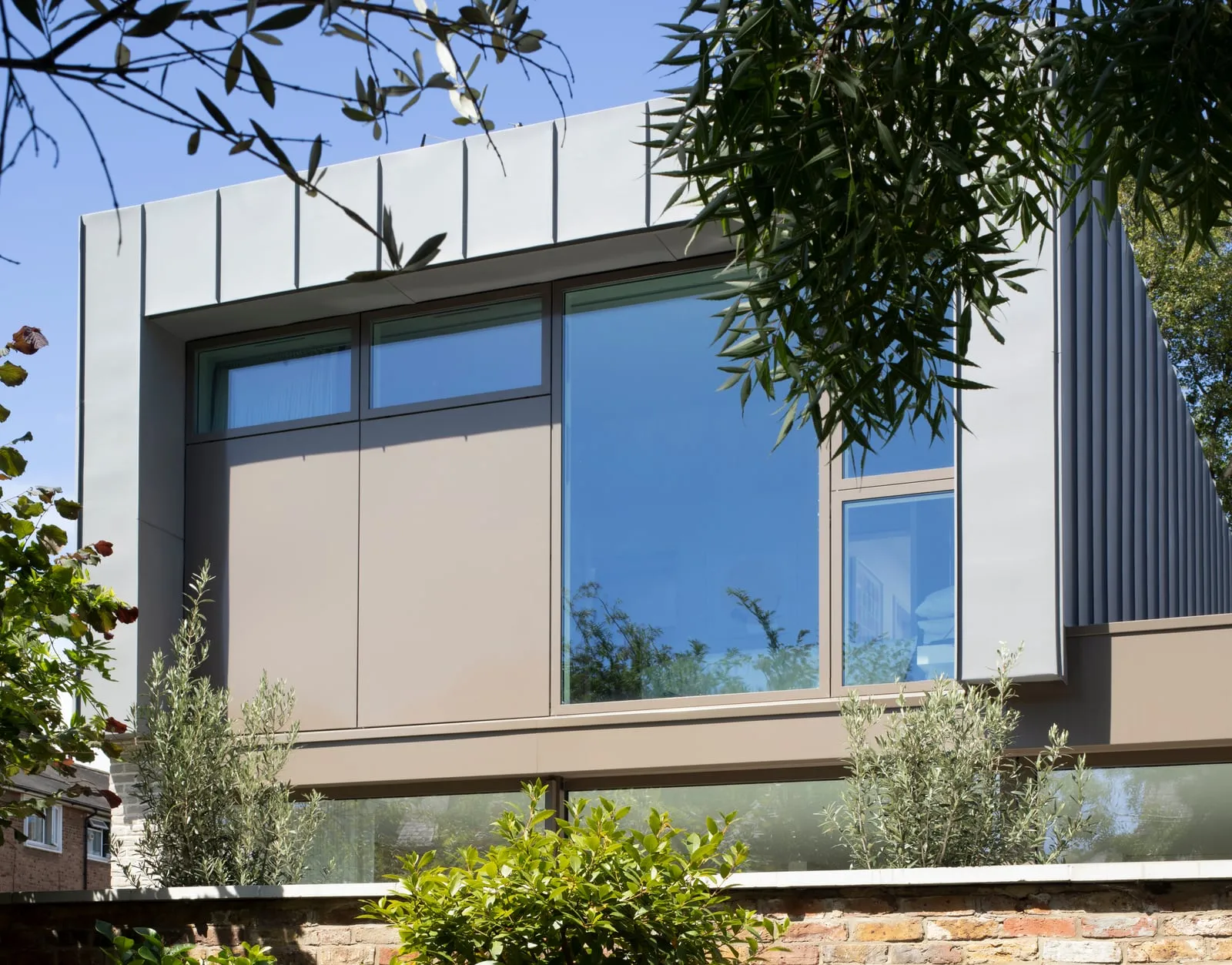 Close detail of zinc cladding and glazing